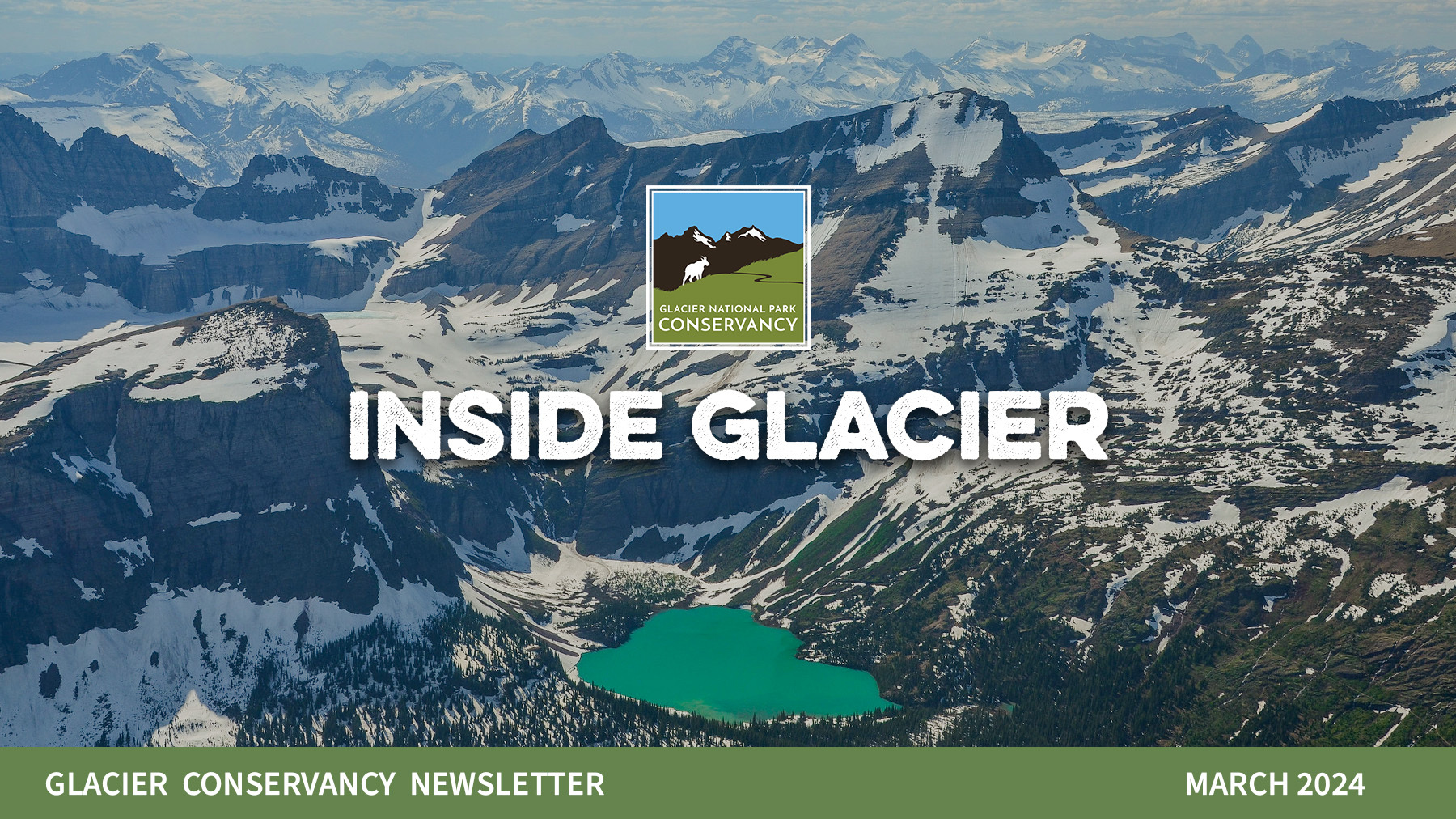 A wide shot of mountains in glaciers in the park.