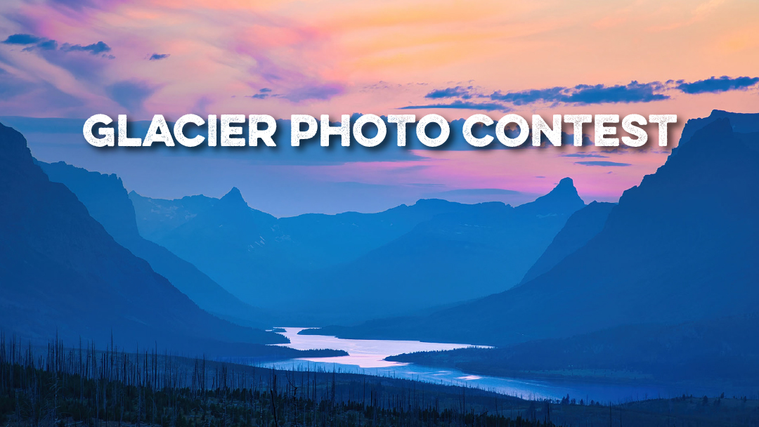 A colorful sunset over a lake and mountains