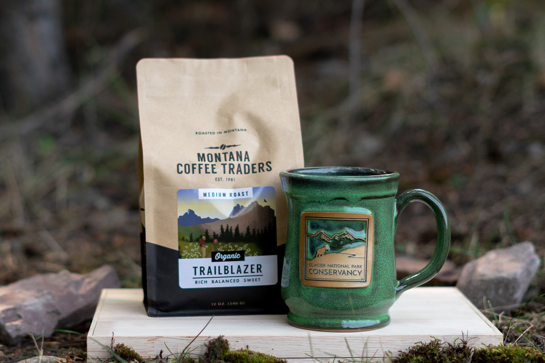 A bag of coffee and a green mug.