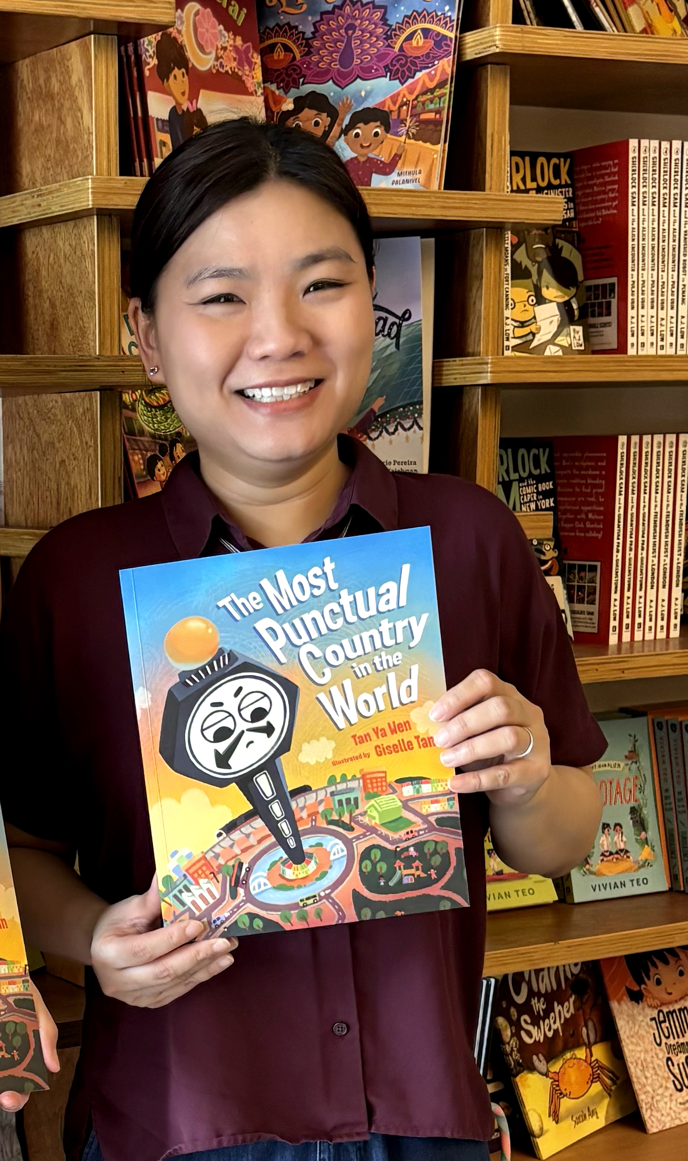 Author Tan Ya Wen with her book