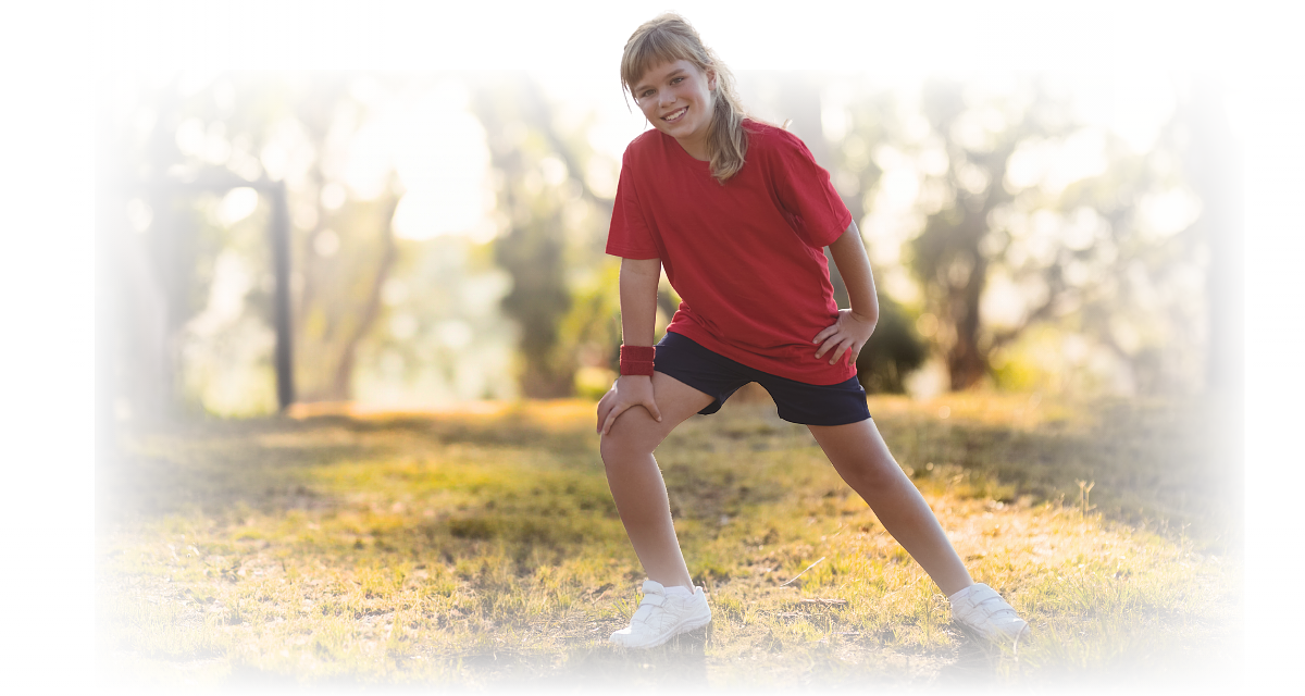 Young athlete holding the front of the knee